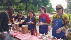 Old North Knoxville Neighborhood Association members scoop ice cream for the residents at Guy B. Love Towers at a celebration May 16 to celebrate Older Americans Month. . 