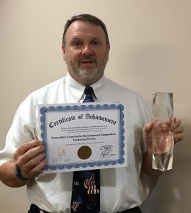 Purchasing Director Terry McKee accepts NIGP accreditation.