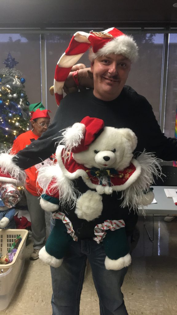 Love Towers resident and Bingo Blitz event coordinator Marvin Romines shows off his favorite tacky Christmas sweater at the annual Christmas Bingo Blitz at Love Towers on Dec. 19.