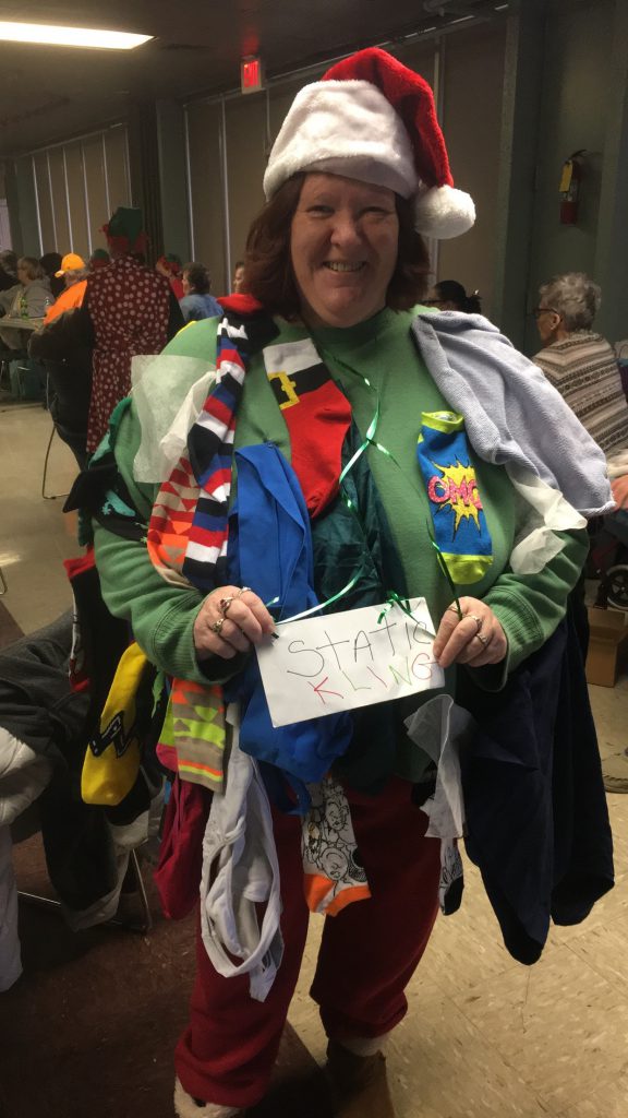 Love Towers resident Shelley Jackson won the tacky Christmas sweater contest with her creative, homemade sweater entitled “Static Kling” at the annual Christmas Bingo Blitz at Love Towers on Dec. 19