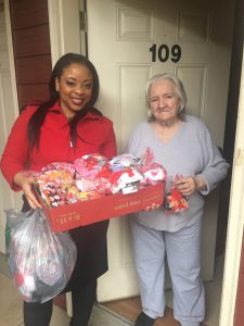 KCDC Administrative Assistant Shana Love delivers a Valentine’s Day care package to Emma Willis at The Verandas on Feb. 14.